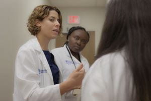 A provider speaks to two residence