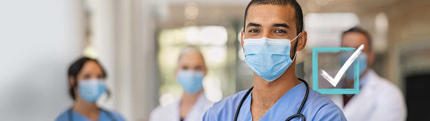 Masked doctors smiling. A checkbox appears on the right. 