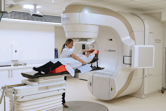 Image of patient and caregiver in imaging studio.